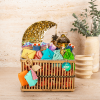 Treasure - bamboo basket with a lights lantern, large crescent moon piñata, themed decoration and Garangoa gifts decorated with Buono chocolate bars.